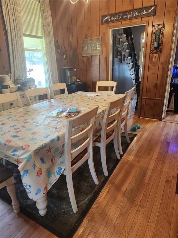 595 N Richhill St, Waynsbrg/Frankln Twp, PA 15370 - dining room featuring wood walls, light wood-style floors, and stairway
