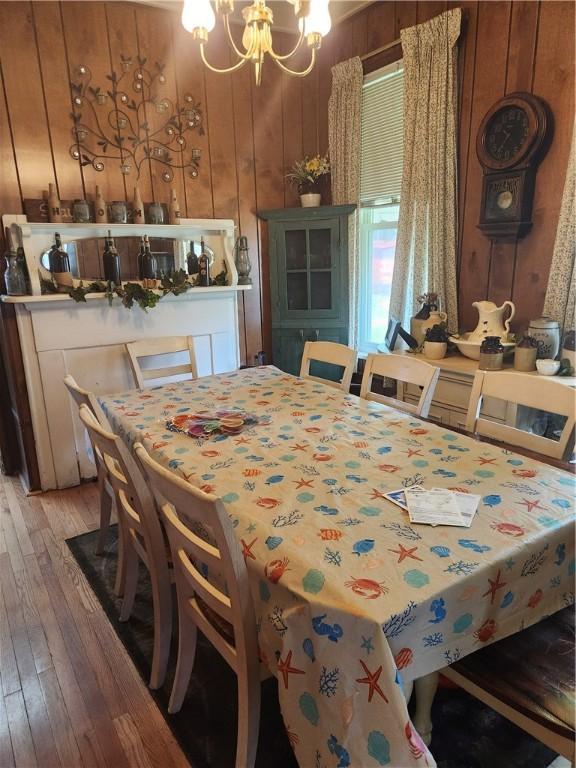 595 N Richhill St, Waynsbrg/Frankln Twp, PA 15370 - dining room with light wood finished floors, a chandelier, and wood walls