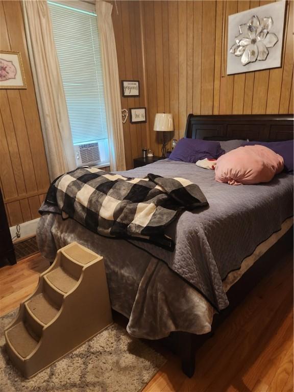 595 N Richhill St, Waynsbrg/Frankln Twp, PA 15370 - bedroom featuring wood finished floors, wood walls, and cooling unit