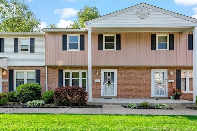 2603 19th St Unit E, Patterson Twp, PA 15010 - view of property featuring brick siding and covered porch