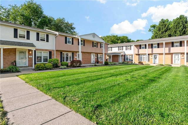 2603 19th St Unit E, Patterson Twp, PA 15010 - view of front of house featuring brick siding, a front lawn, and a residential view