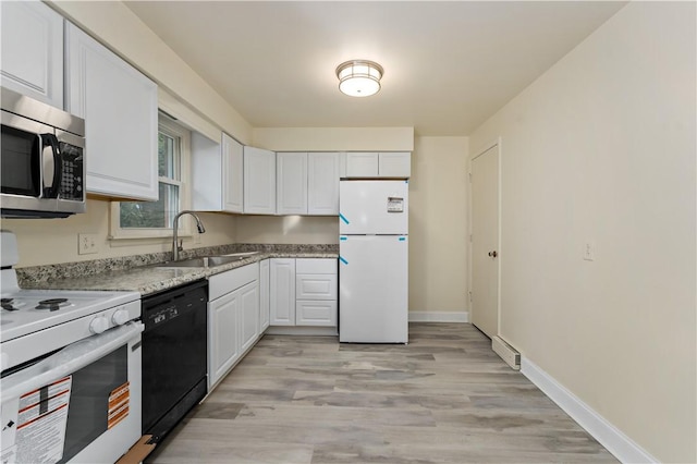 2603 19th St Unit E, Patterson Twp, PA 15010 - kitchen featuring white appliances, a sink, white cabinets, light wood finished floors, and baseboards