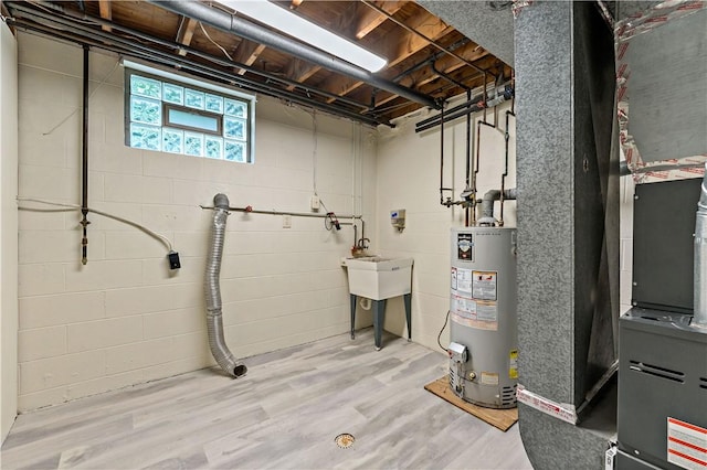 2603 19th St Unit E, Patterson Twp, PA 15010 - below grade area with water heater, wood finished floors, and heating unit