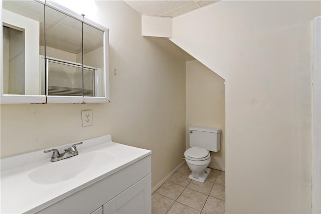 2603 19th St Unit E, Patterson Twp, PA 15010 - bathroom with toilet, vanity, tile patterned flooring, and baseboards
