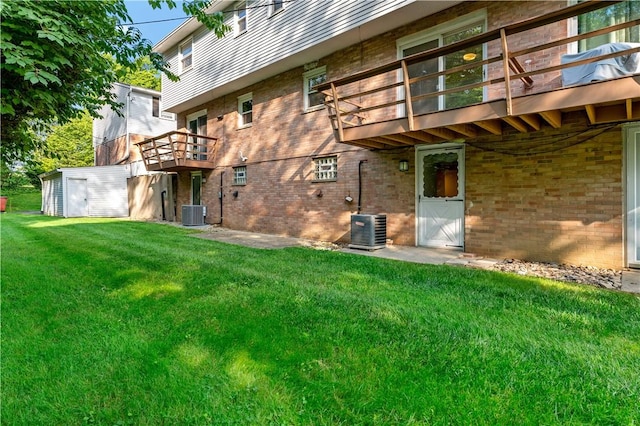 2603 19th St Unit E, Patterson Twp, PA 15010 - back of house featuring brick siding, a yard, central AC unit, and a balcony
