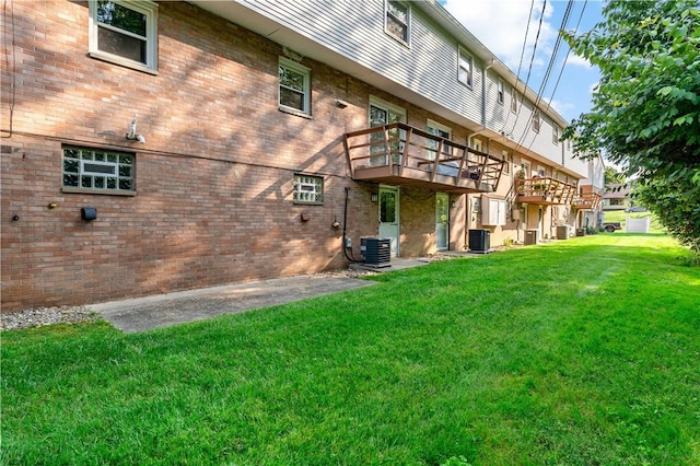 2603 19th St Unit E, Patterson Twp, PA 15010 - rear view of property with a yard, cooling unit, brick siding, and a deck