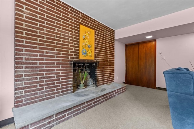 157 Kings Dale Rd, Churchill Boro, PA 15221 - living area with a brick fireplace, carpet, and brick wall