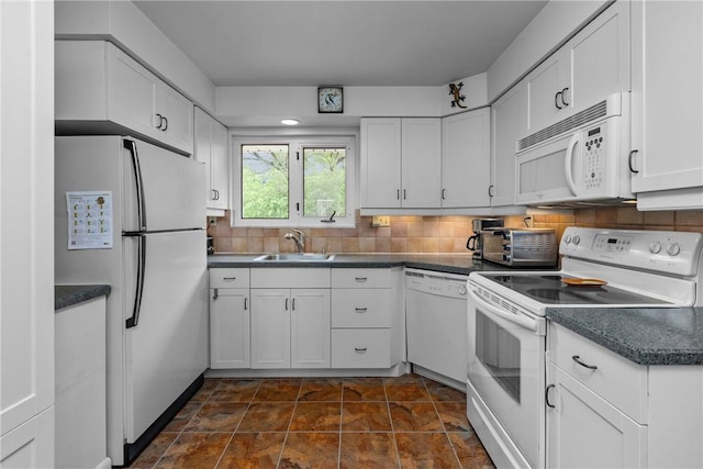 157 Kings Dale Rd, Churchill Boro, PA 15221 - kitchen with white appliances, dark countertops, white cabinetry, a sink, and decorative backsplash