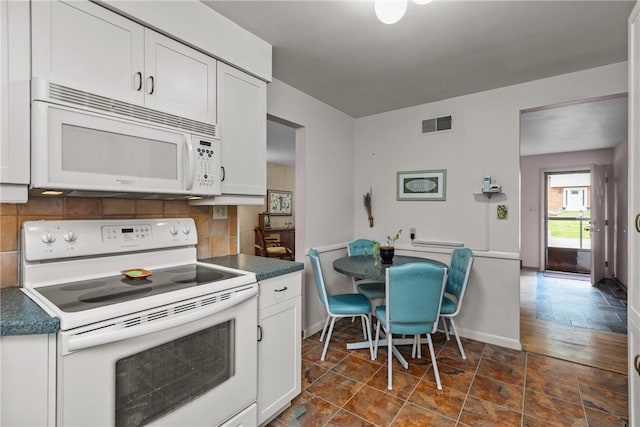 157 Kings Dale Rd, Churchill Boro, PA 15221 - kitchen with white appliances, backsplash, white cabinets, and dark countertops