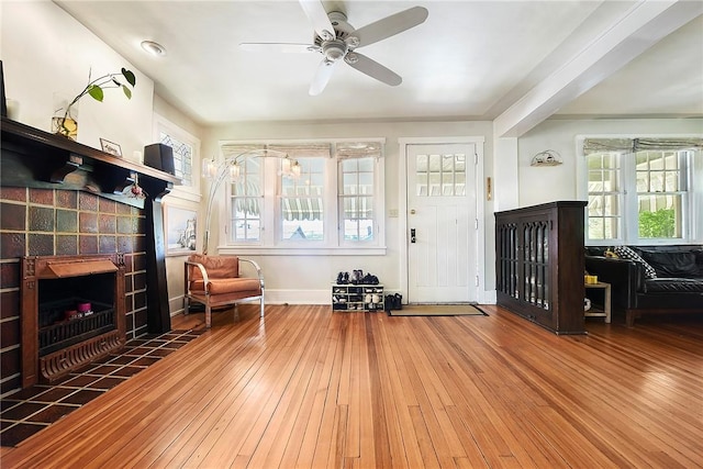 302 3rd St N, Versailles, PA 15137 - foyer entrance with a tiled fireplace, plenty of natural light, hardwood / wood-style flooring, and ceiling fan