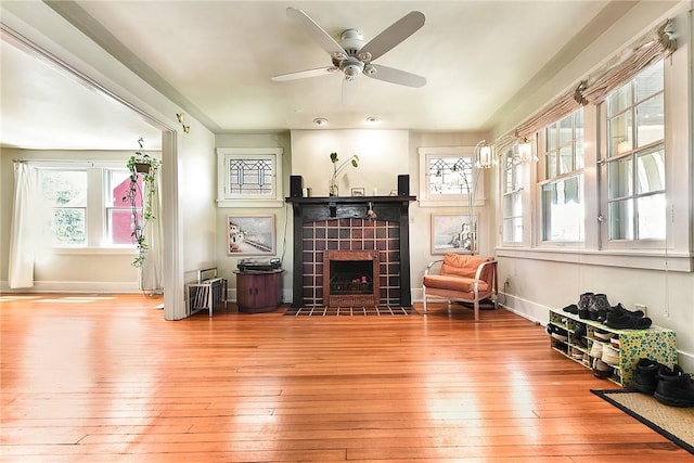 302 3rd St N, Versailles, PA 15137 - living area featuring hardwood / wood-style floors, healthy amount of natural light, a fireplace, and ceiling fan