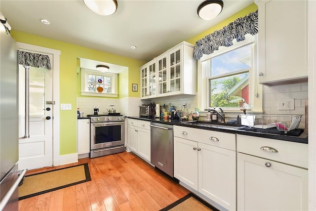 302 3rd St N, Versailles, PA 15137 - kitchen with appliances with stainless steel finishes, dark countertops, tasteful backsplash, white cabinets, and recessed lighting