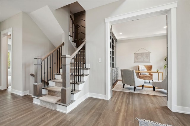 9660 Goehring Rd, Cranberry Twp, PA 16066 - stairway with wood finished floors, baseboards, and recessed lighting