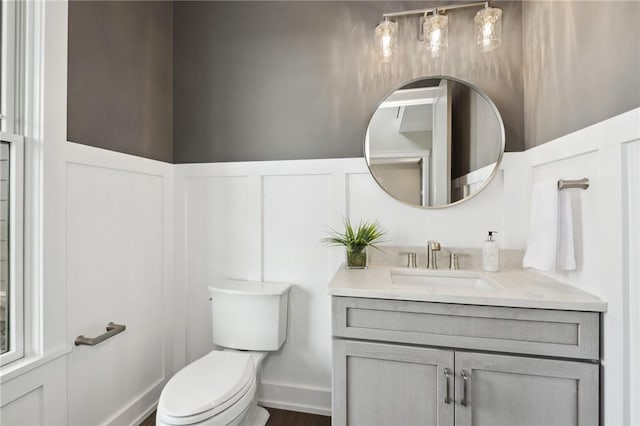 9660 Goehring Rd, Cranberry Twp, PA 16066 - half bath featuring vanity, toilet, and a decorative wall