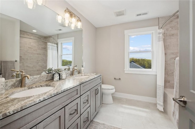 9660 Goehring Rd, Cranberry Twp, PA 16066 - full bath with double vanity, toilet, baseboards, and tiled shower / bath