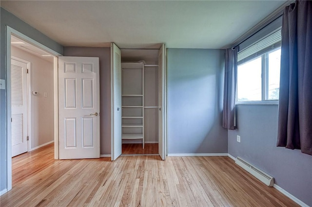 111 York Way, Center Twp Bea, PA 15061 - unfurnished bedroom with baseboard heating, a closet, light wood finished floors, and baseboards