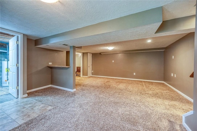 111 York Way, Center Twp Bea, PA 15061 - finished below grade area featuring a textured ceiling, light colored carpet, baseboards, and gas water heater
