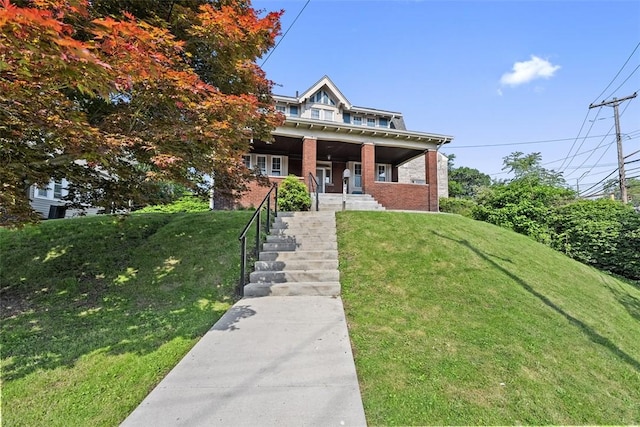 3565 Gerber Ave, Brighton Heights, PA 15212 - view of front of home with a front lawn, brick siding, and covered porch
