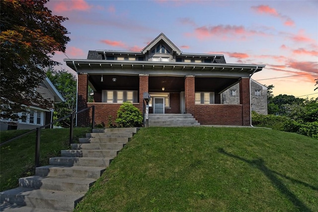 3565 Gerber Ave, Brighton Heights, PA 15212 - american foursquare style home with a front lawn, a porch, and brick siding