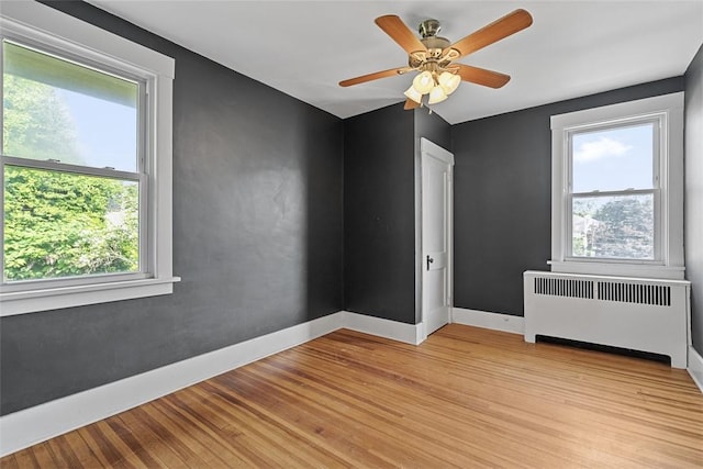 3565 Gerber Ave, Brighton Heights, PA 15212 - empty room featuring radiator, light wood finished floors, baseboards, and ceiling fan