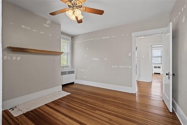 3565 Gerber Ave, Brighton Heights, PA 15212 - unfurnished room featuring radiator, wood finished floors, and plenty of natural light
