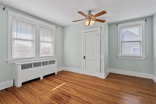 3565 Gerber Ave, Brighton Heights, PA 15212 - empty room featuring radiator, a ceiling fan, light wood-type flooring, and baseboards