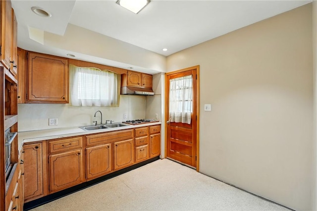 139 Wengler Ave, Sharon, PA 16146 - kitchen featuring a sink, under cabinet range hood, brown cabinets, stainless steel gas stovetop, and light countertops