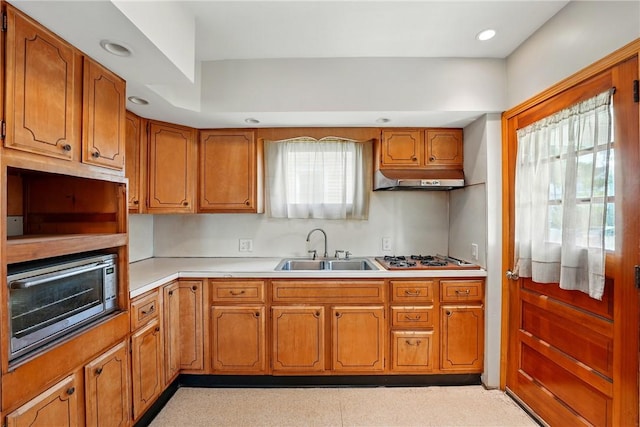 139 Wengler Ave, Sharon, PA 16146 - kitchen with a sink, brown cabinets, gas cooktop, light countertops, and extractor fan