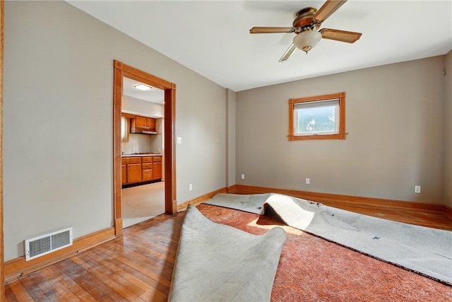 139 Wengler Ave, Sharon, PA 16146 - unfurnished room with wood finished floors, ceiling fan, and baseboards