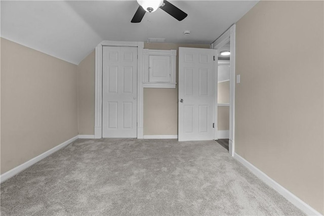 213 Highland Ave, Pitcairn, PA 15140 - unfurnished bedroom with carpet flooring, vaulted ceiling, baseboards, ceiling fan, and a closet