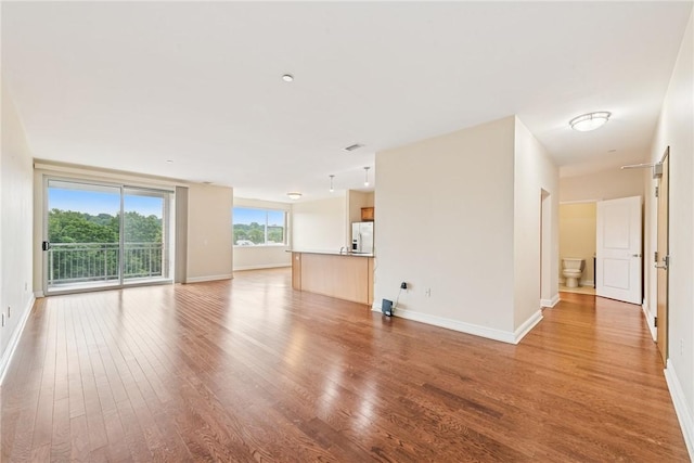 5570 Centre Ave Unit 306, Shadyside, PA 15232 - unfurnished living room featuring light wood-type flooring