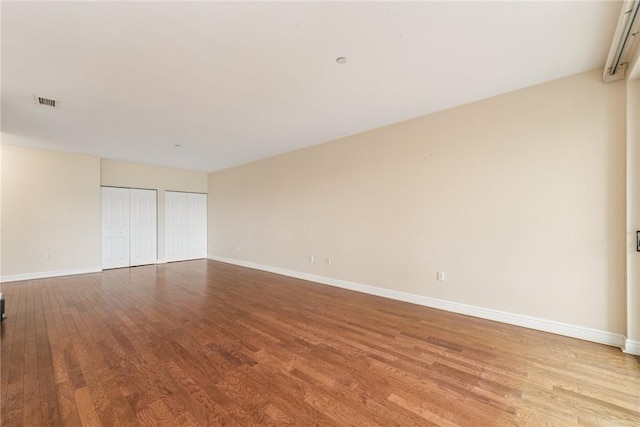 5570 Centre Ave Unit 306, Shadyside, PA 15232 - spare room with wood finished floors and baseboards