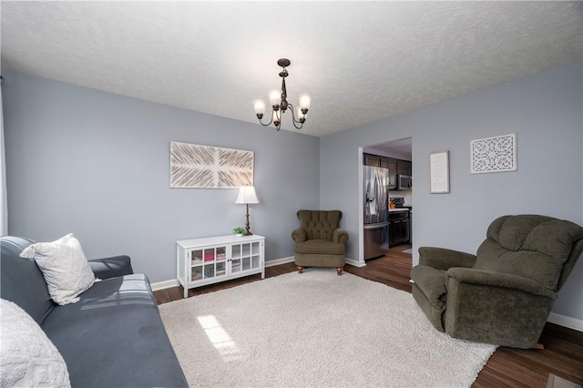 132 Naughton Cir, Forward Twp But, PA 16033 - living room featuring a chandelier, baseboards, and wood finished floors