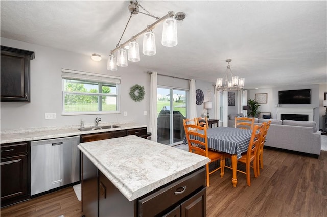 132 Naughton Cir, Forward Twp But, PA 16033 - kitchen featuring stainless steel dishwasher, a sink, light countertops, dark brown cabinets, and a chandelier
