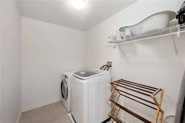 132 Naughton Cir, Forward Twp But, PA 16033 - laundry area with washer and dryer and baseboards