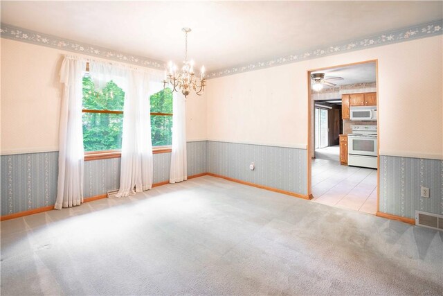 3460 Ridgewood Dr, Hermitage, PA 16148 - unfurnished room with wallpapered walls, a chandelier, wainscoting, carpet flooring, and baseboards