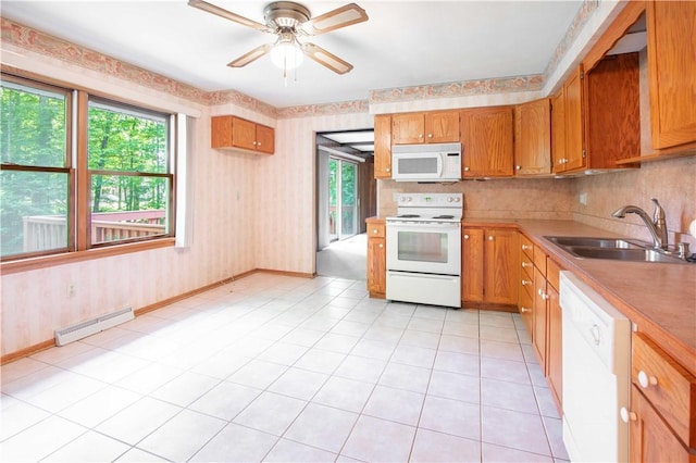 3460 Ridgewood Dr, Hermitage, PA 16148 - kitchen with white appliances, a sink, a baseboard heating unit, healthy amount of natural light, and wallpapered walls