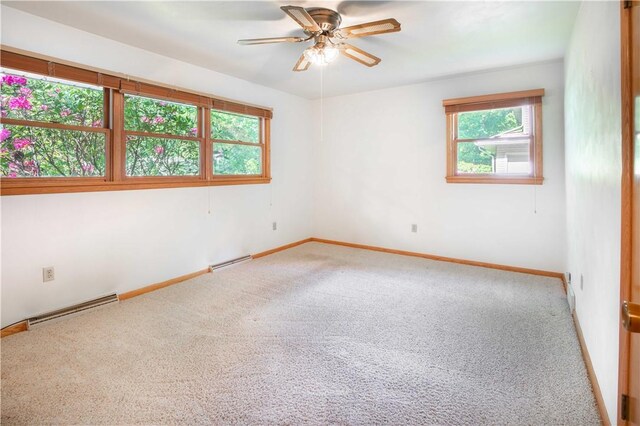 3460 Ridgewood Dr, Hermitage, PA 16148 - carpeted spare room with plenty of natural light, a baseboard radiator, a ceiling fan, and baseboards
