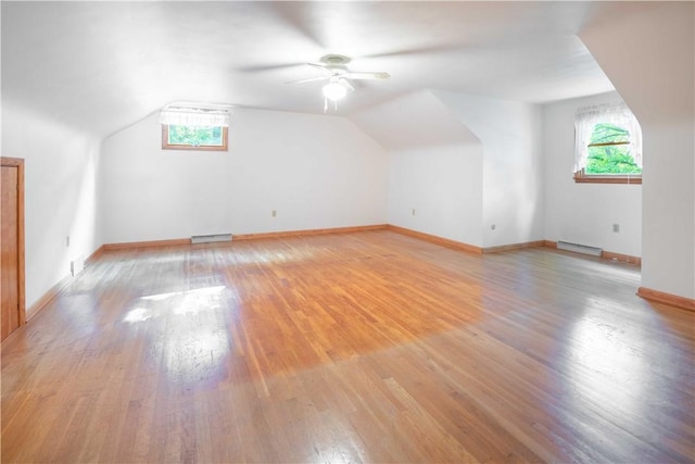 3460 Ridgewood Dr, Hermitage, PA 16148 - additional living space with a baseboard radiator, light wood-style flooring, plenty of natural light, vaulted ceiling, and ceiling fan