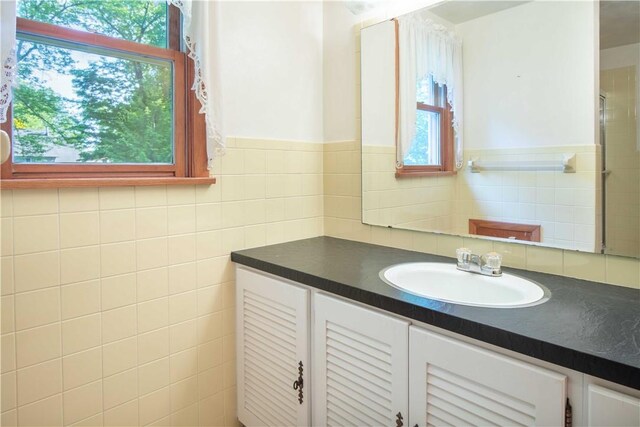 3460 Ridgewood Dr, Hermitage, PA 16148 - bathroom featuring vanity and tile walls