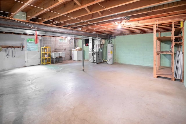 3460 Ridgewood Dr, Hermitage, PA 16148 - below grade area with gas water heater, heating unit, washer and clothes dryer, and concrete block wall