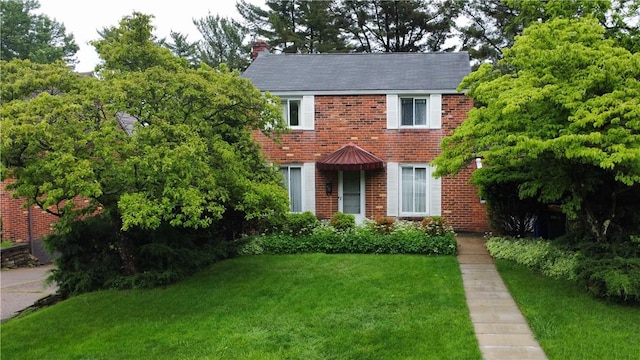 612 Highview Rd, Baldwin Twp, PA 15234 - view of front of property featuring a front lawn, brick siding, and a chimney