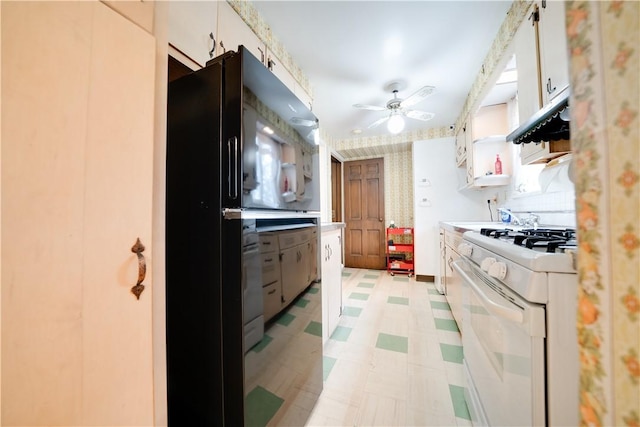 612 Highview Rd, Baldwin Twp, PA 15234 - kitchen featuring gas range gas stove, light flooring, freestanding refrigerator, ceiling fan, and light countertops
