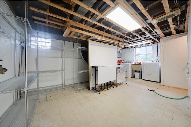 612 Highview Rd, Baldwin Twp, PA 15234 - basement with washer and dryer, tile patterned floors, and a sink