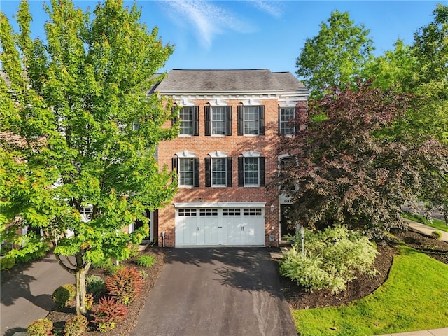 901 Montclair Dr, Moon/Crescent Twp, PA 15108 - view of front facade featuring a garage, driveway, and brick siding
