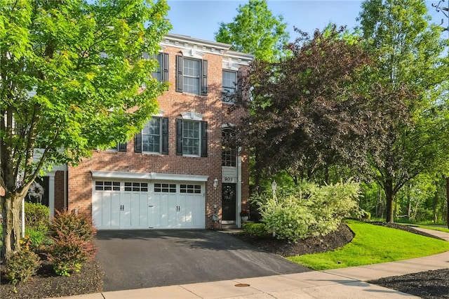 901 Montclair Dr, Moon/Crescent Twp, PA 15108 - view of front of home featuring asphalt driveway, a garage, and brick siding