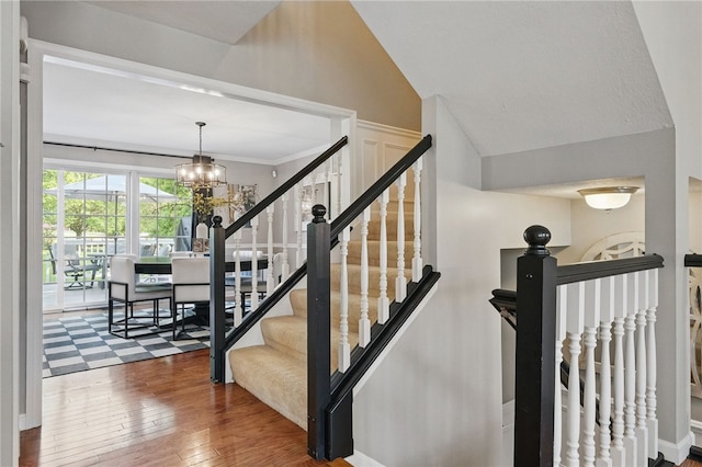 901 Montclair Dr, Moon/Crescent Twp, PA 15108 - stairs with hardwood / wood-style flooring and a chandelier