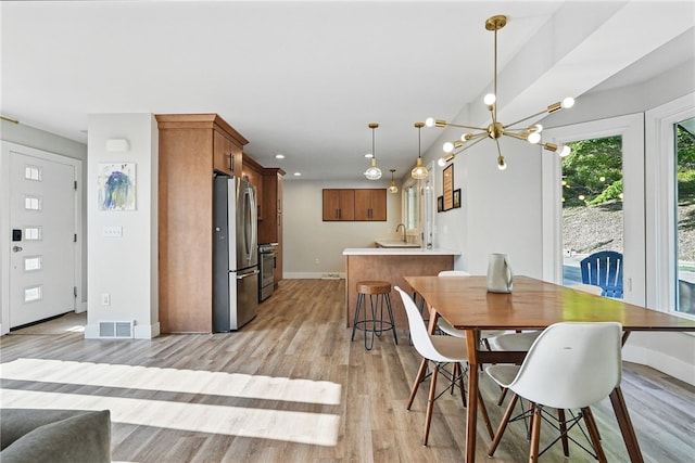 118 Eakin Ave, Ross Twp, PA 15214 - dining space with baseboards, light wood-style flooring, a chandelier, and recessed lighting