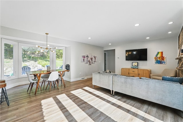 118 Eakin Ave, Ross Twp, PA 15214 - living area with a chandelier, light wood finished floors, recessed lighting, and baseboards