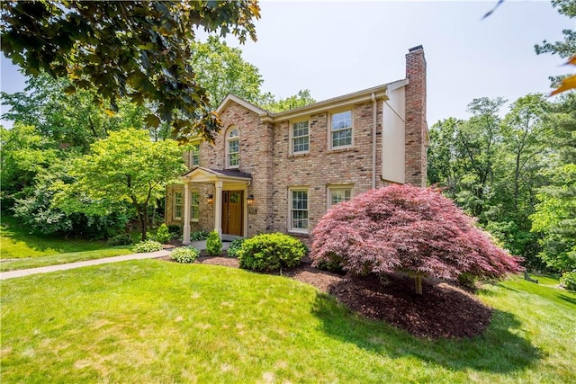 511 Clubview Dr, Peters Twp, PA 15317 - view of front of property featuring a chimney, a front lawn, and brick siding